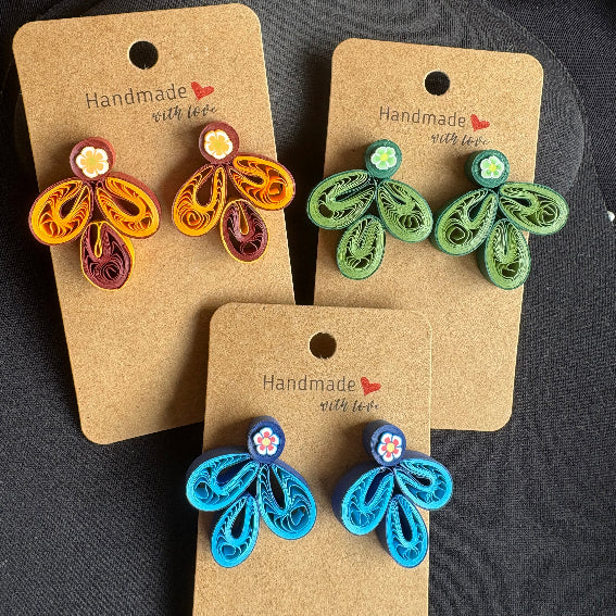 Three pairs of handmade earrings on brown cards with 'Handmade with Love' text.